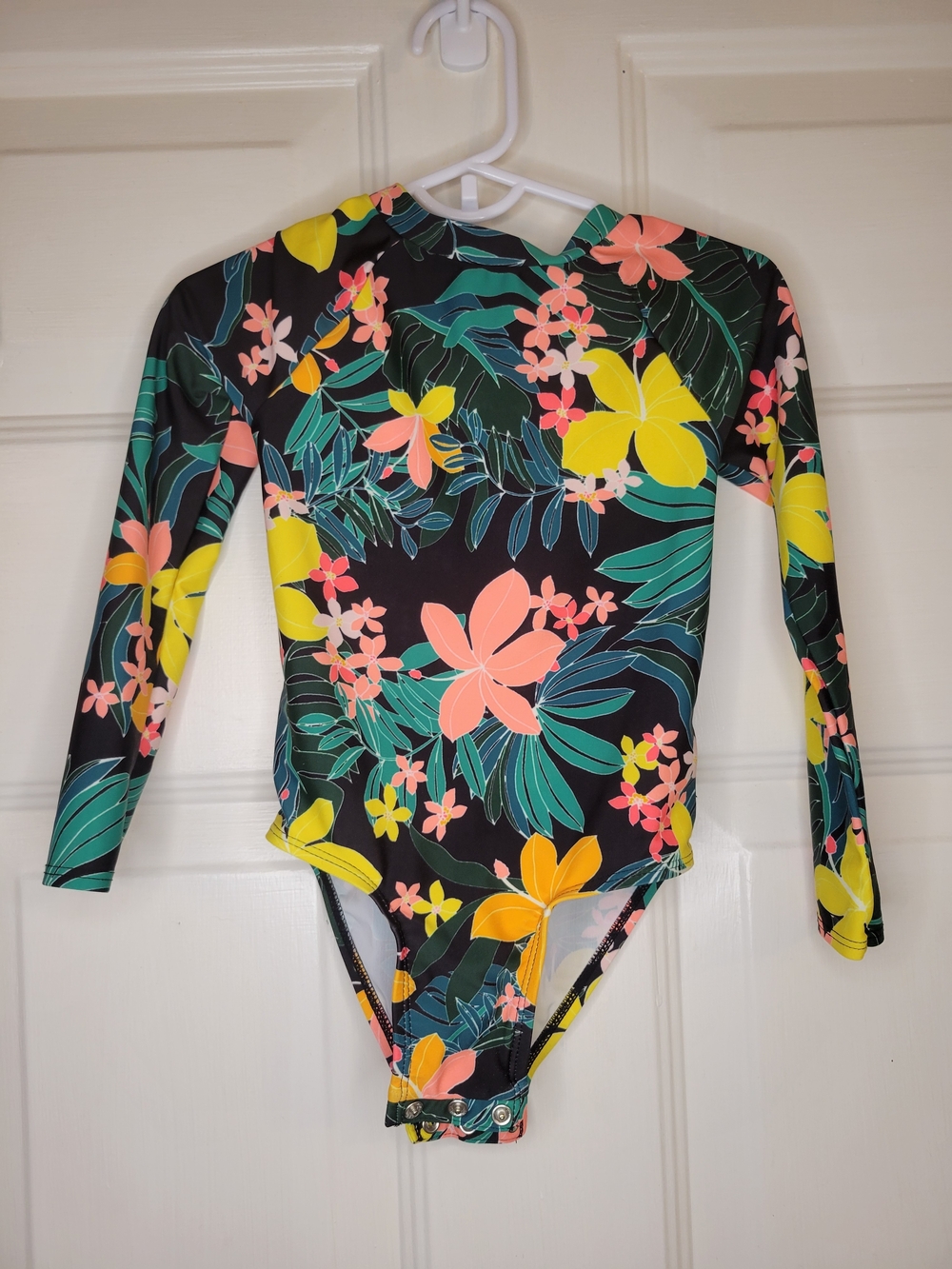 Old Navy toddler girl's long-sleeve, one-piece swimsuit featuring a black floral